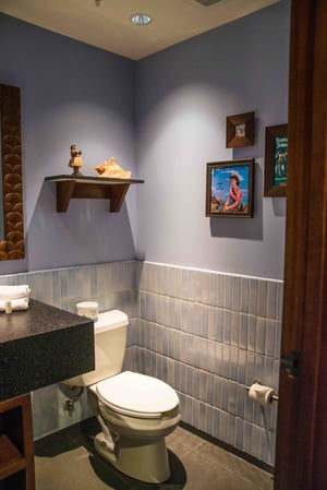 Purple tones decorate the guest bathroom