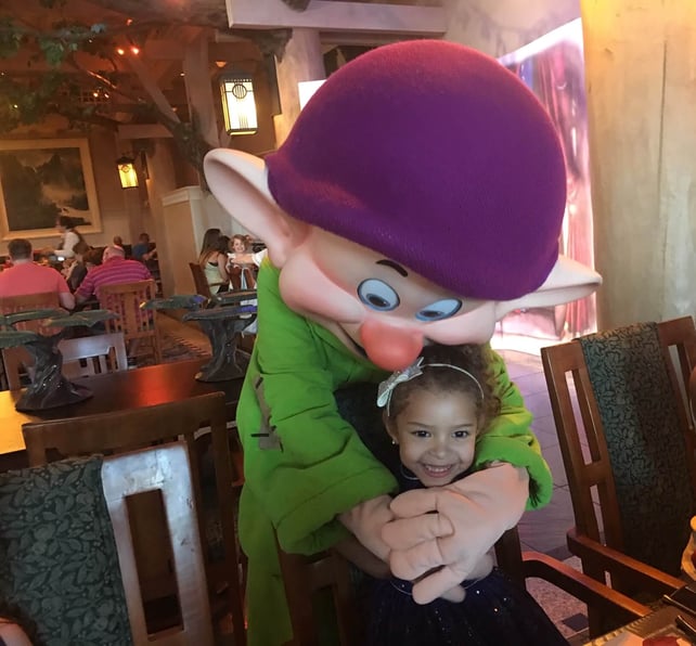 Dopey Dwarf hugging a little girl at the Wilderness Lodge Resort