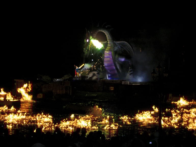 Fantasmic dragon breathing green fire