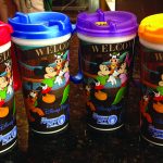 A red, blue, purple and orange mug for a special meet and greet at Walt Disney World