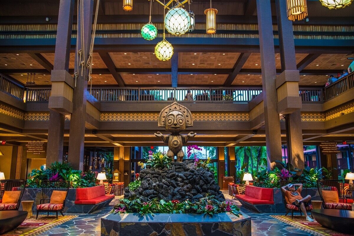 Disney Vacation Club Polynesian Village Resort lobby statue and decorated sitting area.