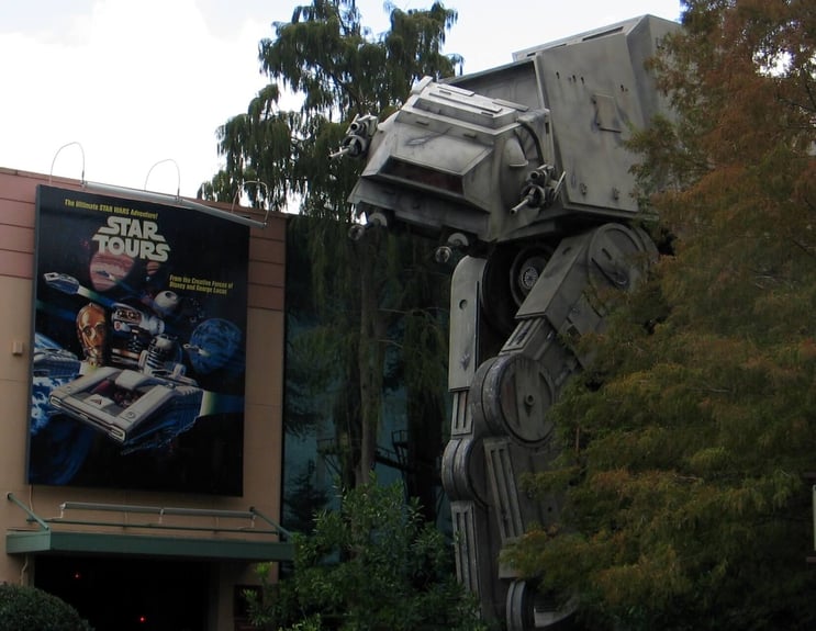 Star Tours sign at Disney in front of an AT-AT walker