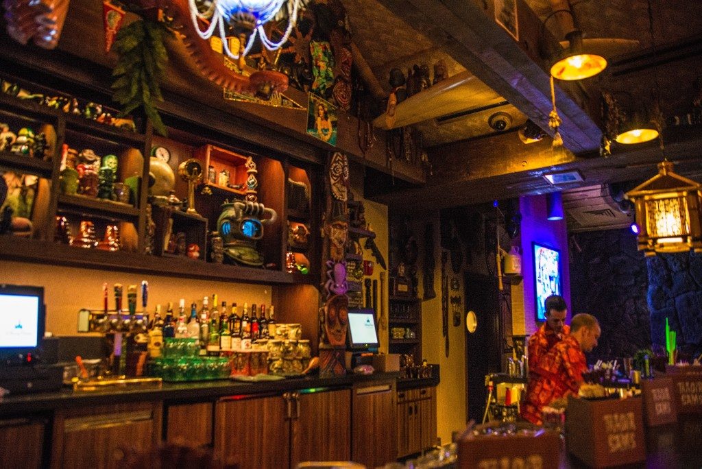 A bartender makes a drink at Trader Sam's bar at Disney's Polynesian Resort