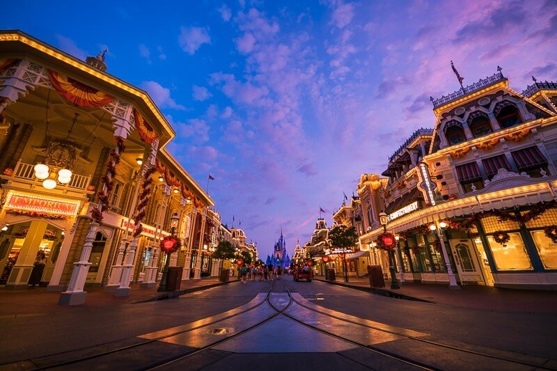 Bulidings with white lights at dawn on main street at the magic kingdom at disney world 