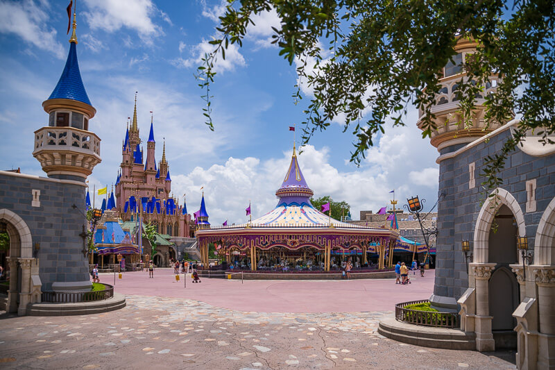 Disney's Magic Kingdom view with Cinderella Castle and Prince Charming Carousel