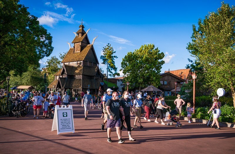 Disney's Magic Kingdom and guest pictured with masks during pandemic
