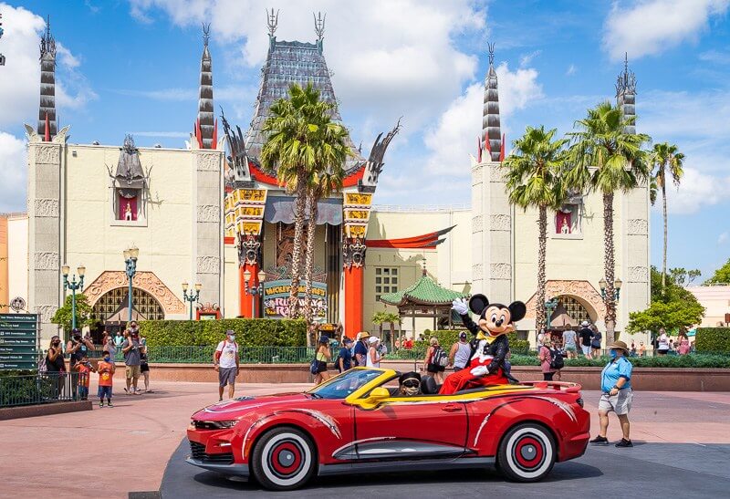 Mickey pictured waving from a Cars convertible at Disney's Hollywood Studios 