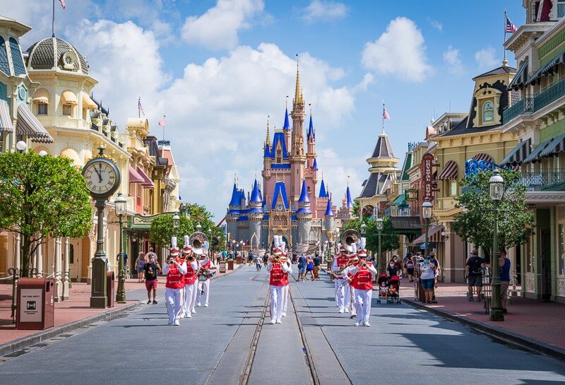 Band pictured in a parade in front of Cinderella Castle at Disney World