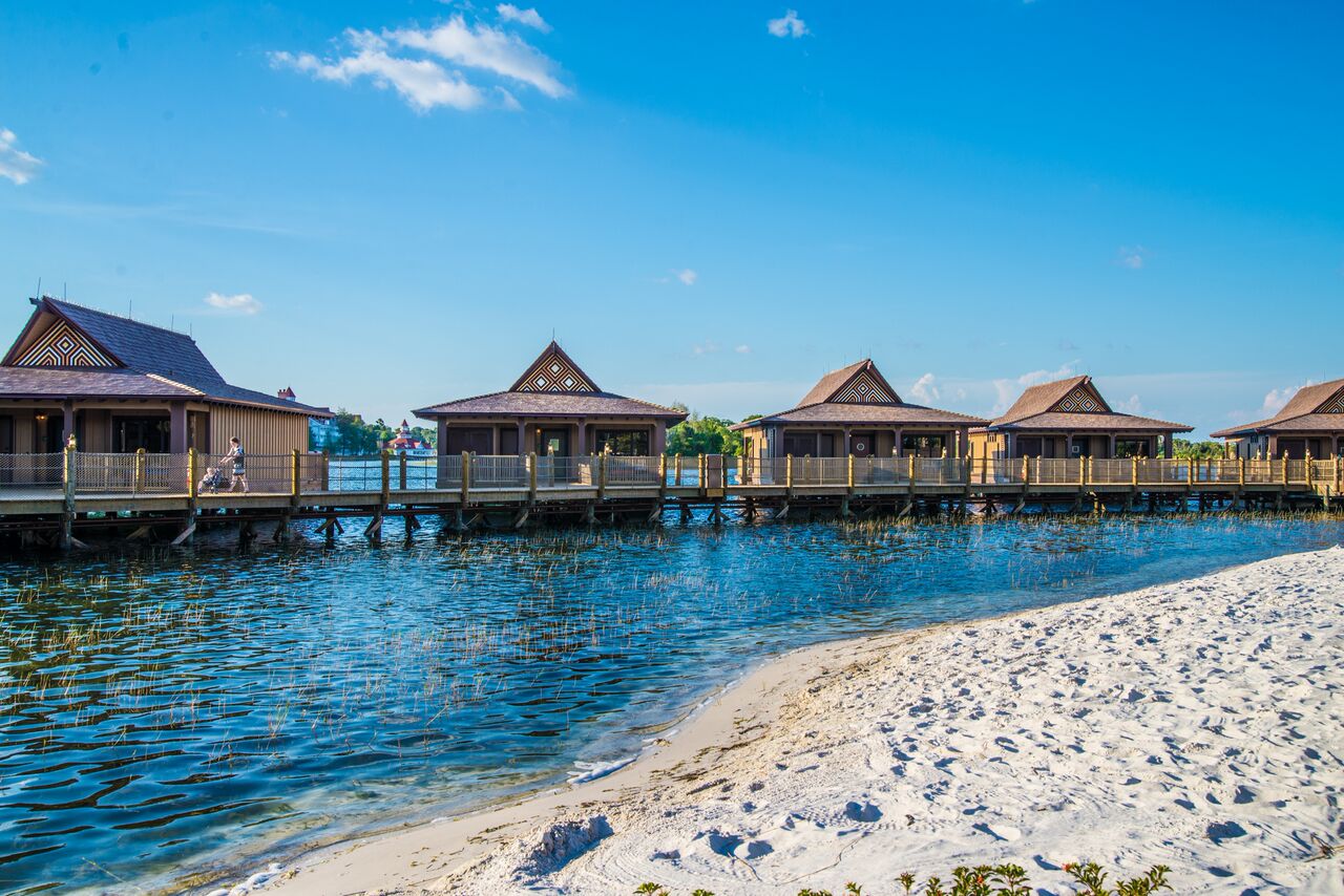 Five Disney Polynesian bungalows on the beach of Seven Seas Lagoon
