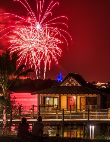 Disney's Polynesian Resort at night with fireworks overhead