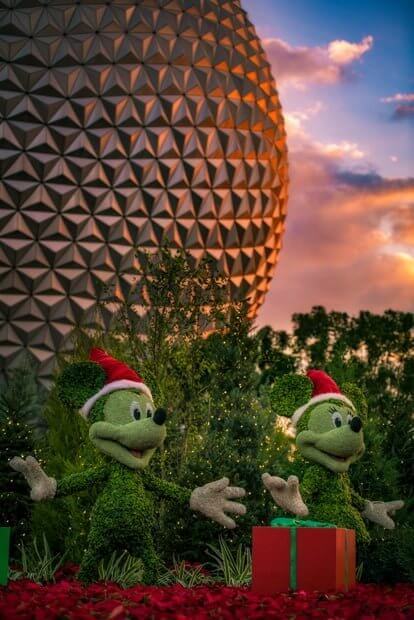 Santa Mickey and Minnie in EPCOT at sunset