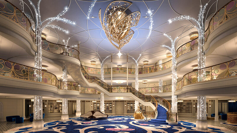 Inside DCL's latest addition, the Disney Wish, a modern fleet with multiple floors, indigo carpets and bright magical lighting.