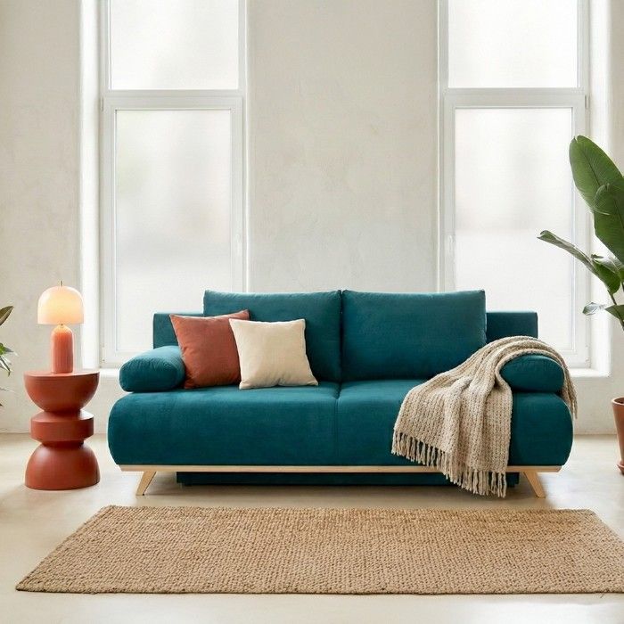 Produit similaire: Canapé convertible 3 places avec coffre de rangement en velours bleu canard - Laria