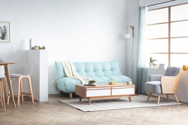 Canapé convertible scandinave en tissu menthe à l'eau et bois clair YUMI