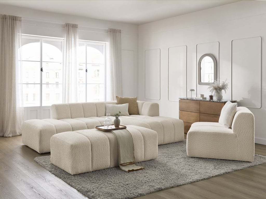 Produit similaire: Canapé d'angle fixe modulable ANNECY tissu bouclette avec 1 chauffeuse 1 place et 1 pouf beige angle droit BOBOCHIC 5 places