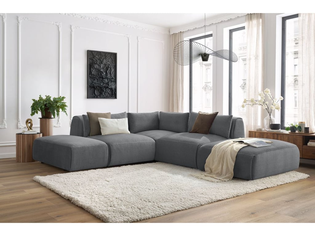Produit similaire: Canapé d'angle fixe modulable JEANNE tissu velours avec 2 chauffeuses, 1 angle et 2 poufs gris foncé réversible BOBOCHIC 5 places