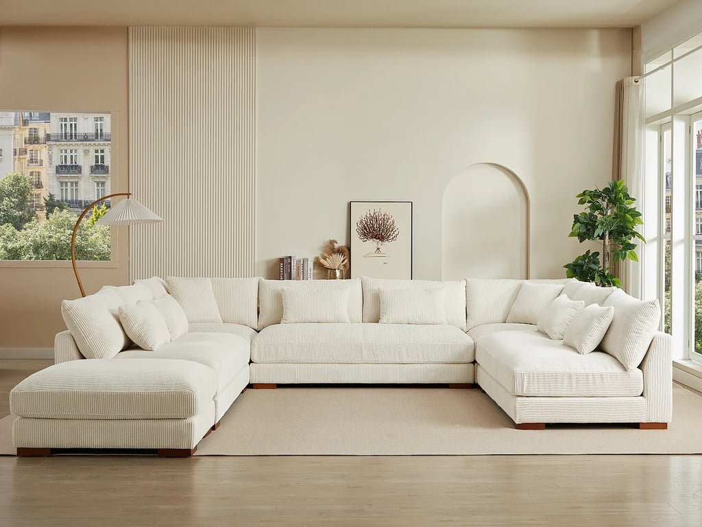 Grand canapé d'angle panoramique et pouf en velours côtelé beige SPERONE