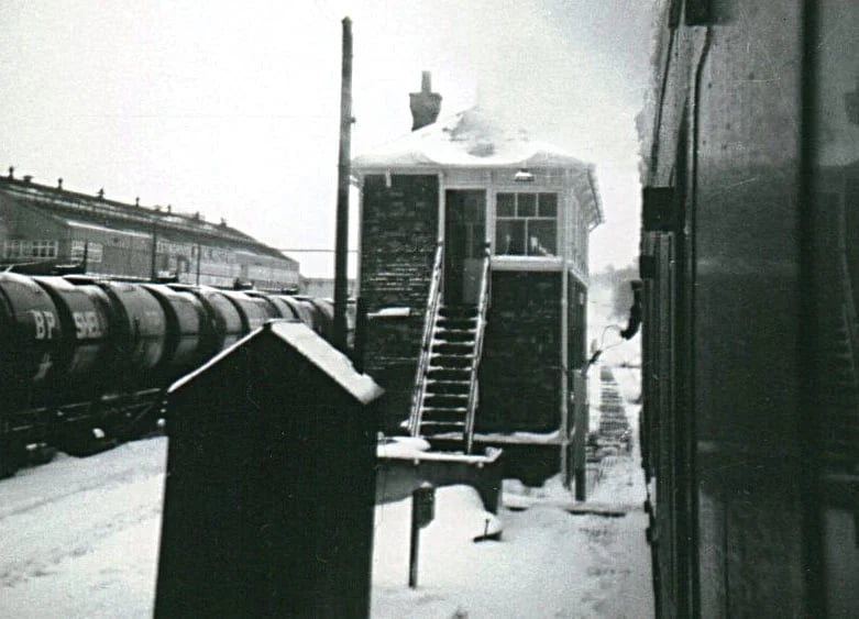 Token exchange at the Chippenham East signal box in the snow