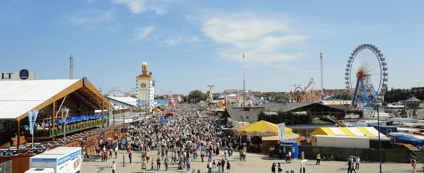 Oktoberfest beer tents and crowds in Munich with Bavarian flag