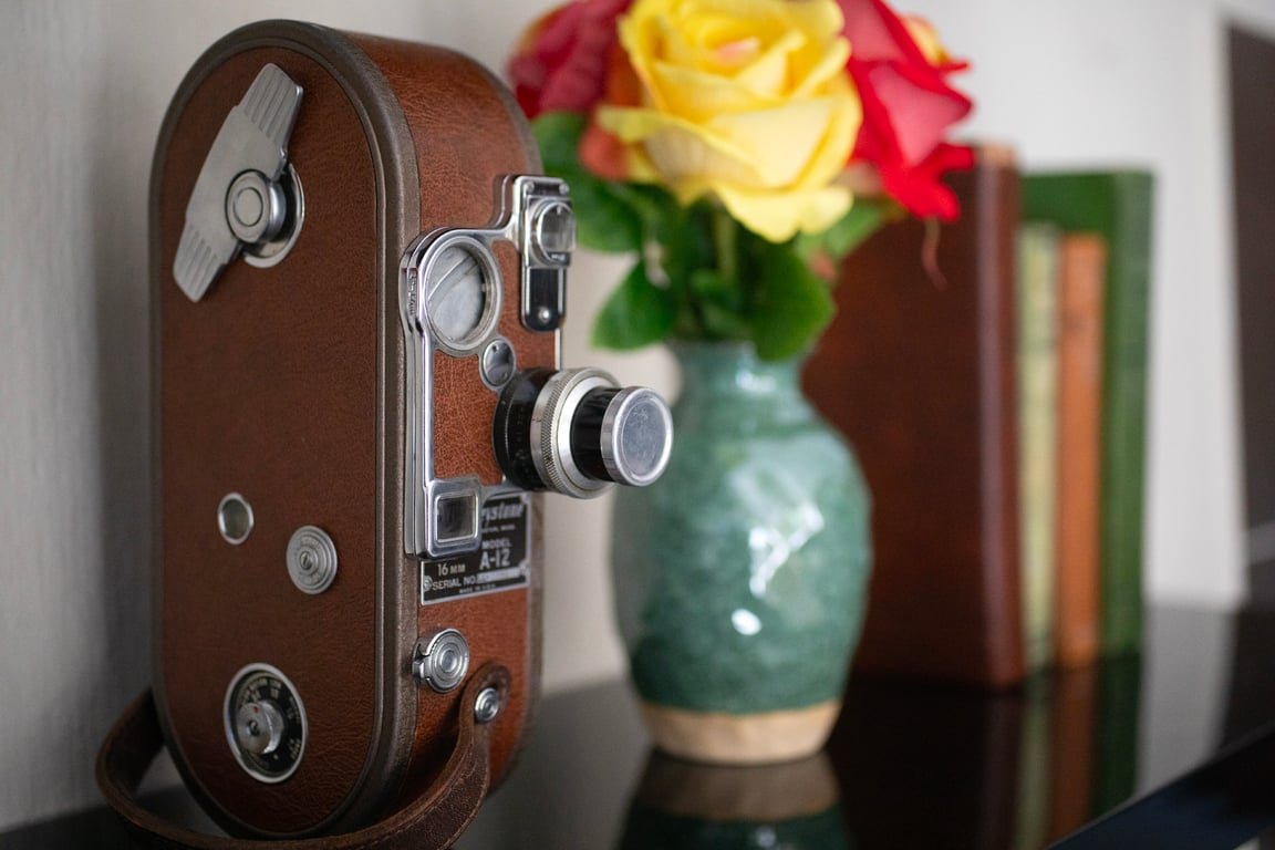 Vintage camera with flowers and books at Chaplin Manor