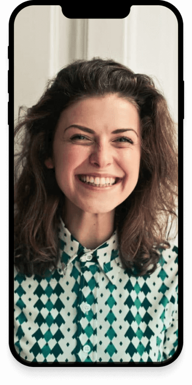 A young woman smiling.