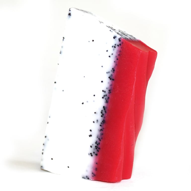 Loaf of dragon fruit soap in tropical paradise style, with soft pink and bright green gradient.