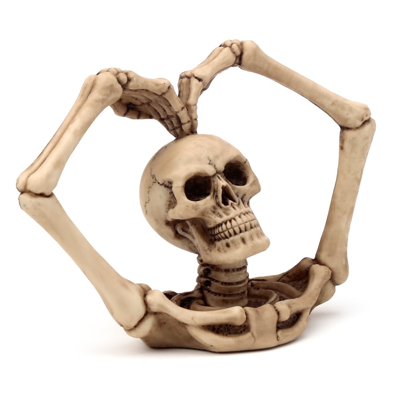 Gothic Resin Skull Decoration with Skeleton Arms and Heart Design