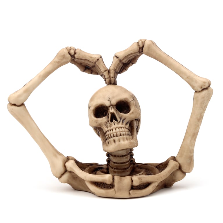 Gothic Resin Skull Decoration with Skeleton Arms and Heart Design