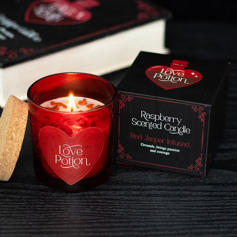 Love Potion Raspberry Crystal Chip Candle - Romantic Scented Paraffin Wax Candle with 20 Hour Burn Time and Red Jasper Chips for Enhanced Passion and Courage.