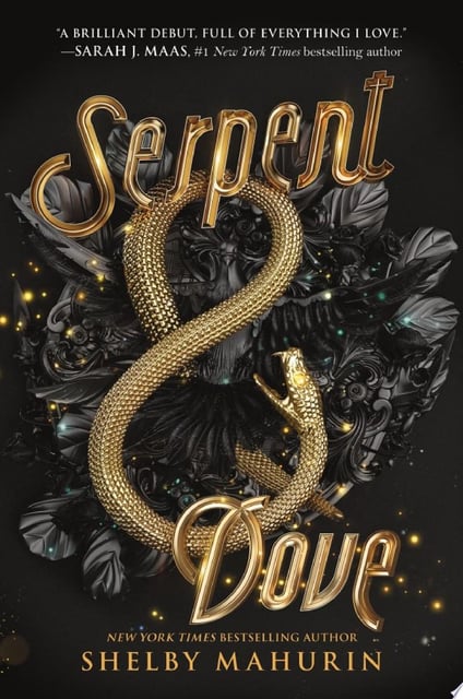 The cover features a gold snake coiled in the shape of an ampersand, set against a textured black background with dark floral elements. Tiny glowing orbs add a mystical touch, enhancing the fantasy feel.