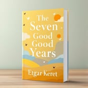 standing book mockup, Its title is "The Seven Good Years". Its author name is Etgar Keret.  A serene landscape with a golden yellow sky fading into a light blue horizon line. Abstract shapes in shades of yellow, orange, and white float above the landscape, symbolizing diverse thoughts and ideas. Birds in flight are scattered throughout the composition, representing freedom and the pursuit of knowledge. The book title "The Seven Good Years" is written in a bold, modern font in white, placed at the top of the cover. The author's name, "Etgar Keret", is written in a more elegant, script-like font in white, placed at the bottom of the cover., The title and author's name are centered and placed on a transparent overlay, allowing the serene landscape and abstract shapes to be seen beneath. The birds are positioned to create a sense of movement and balance within the composition.