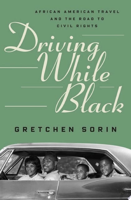 The cover features a vintage car with an African American family, emphasized by a monochrome photograph set against a muted green background. The title is prominently displayed in a script font, juxtaposing the modernity of the font with the classical style of the imagery.