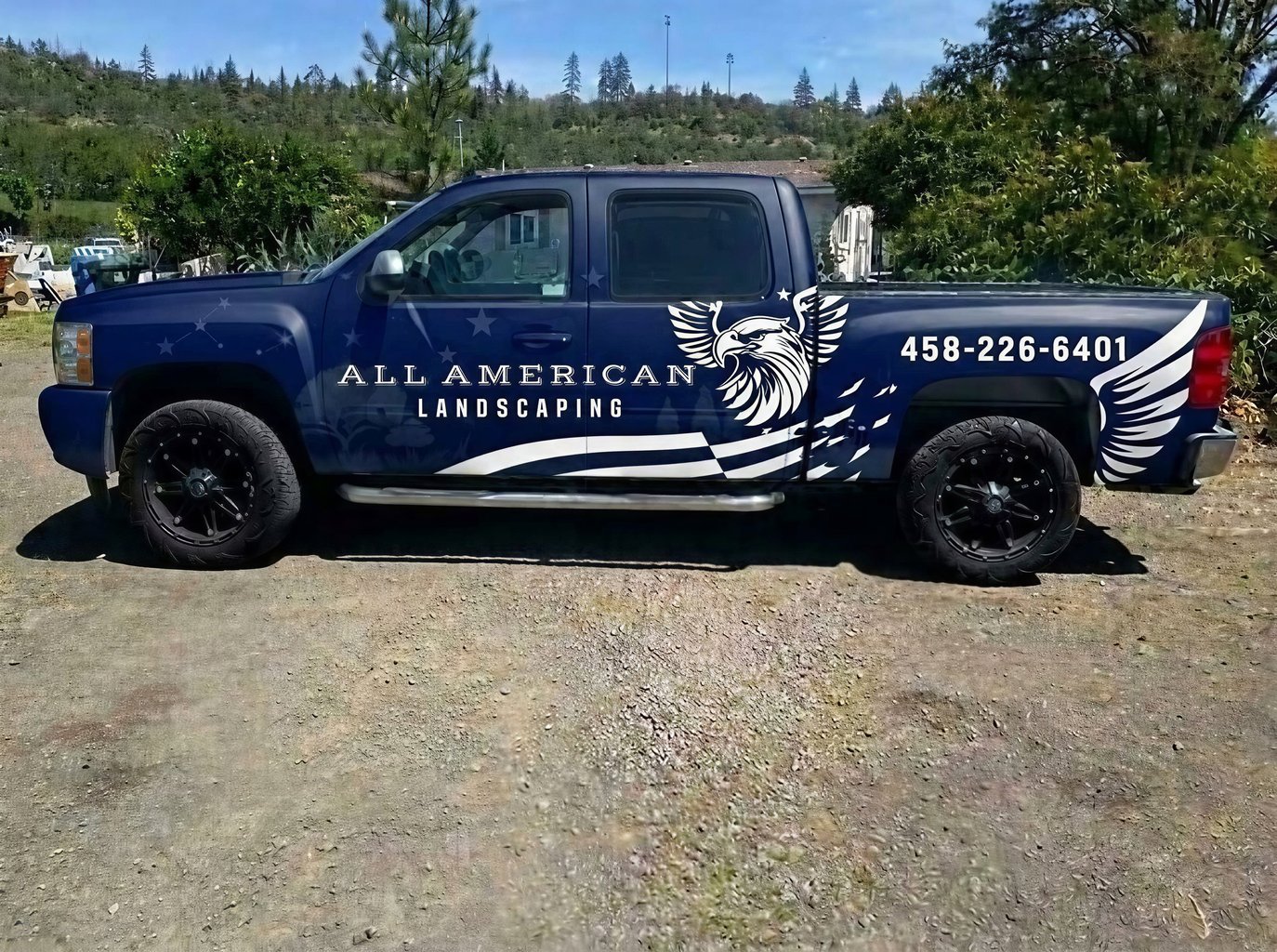 Dark Blue Pickup Truck Wrap with Bold Landscaping Theme