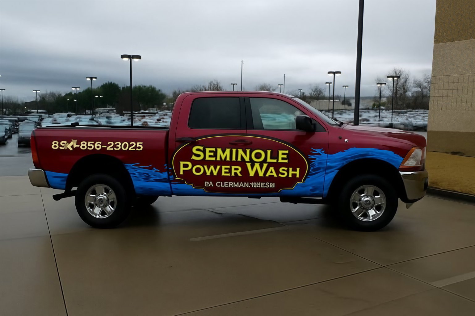 Pickup truck wrap with garnet and blue pressure washing design