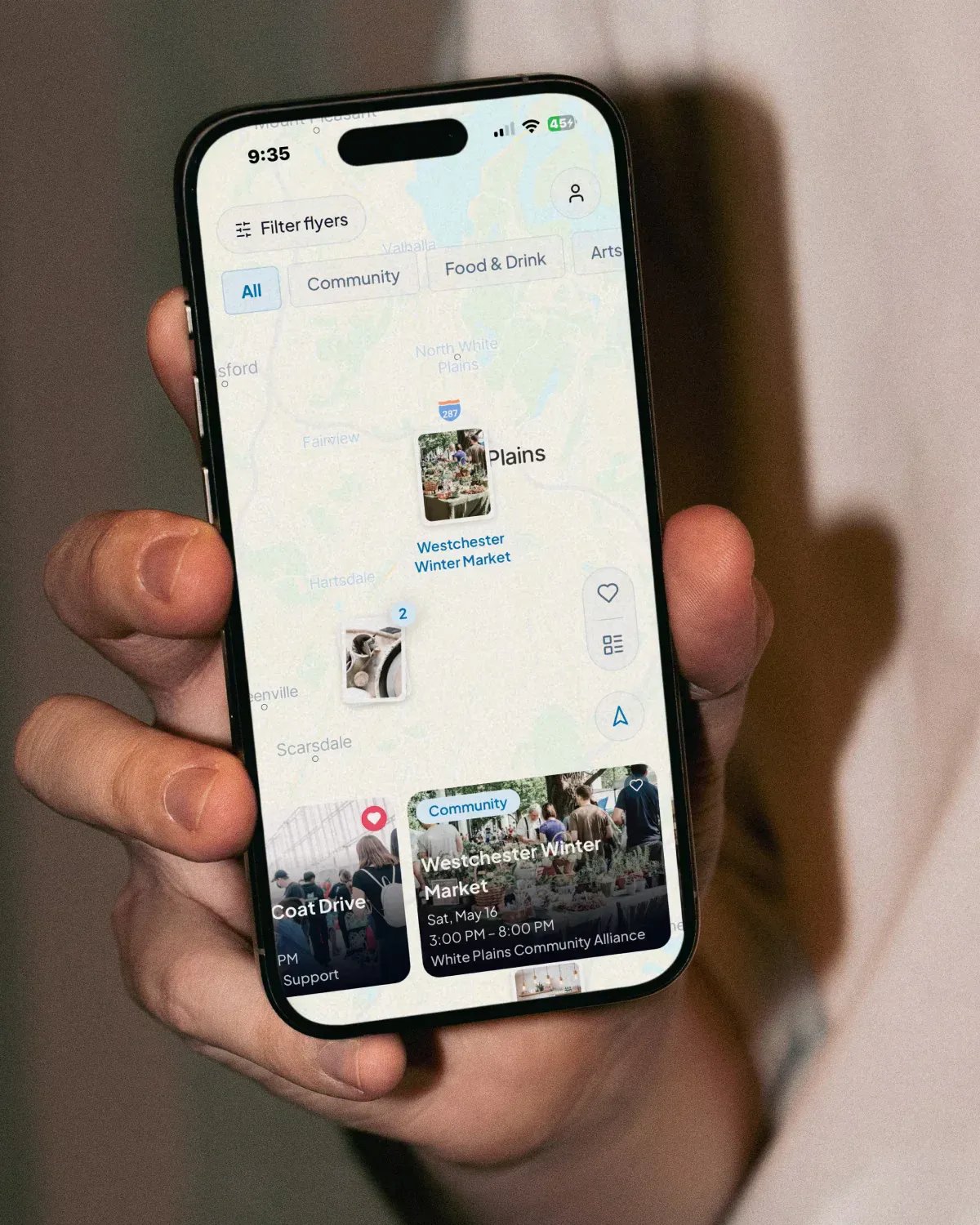 Man holding iphone with Buzlee map