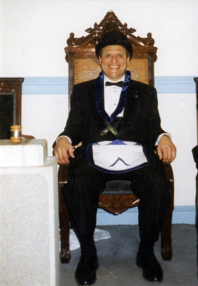 David Catucci seated as Worshipful Master of his Masonic lodge