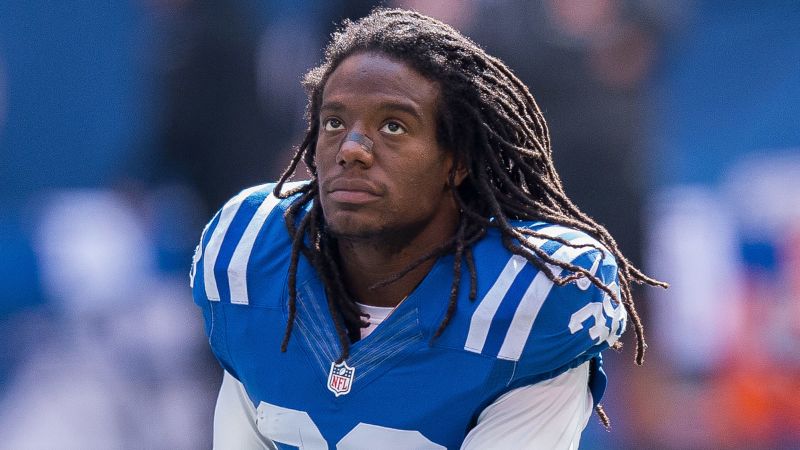 Photo of Former NFL player Sergio Brown taken into custody in the murder of his mother, police say