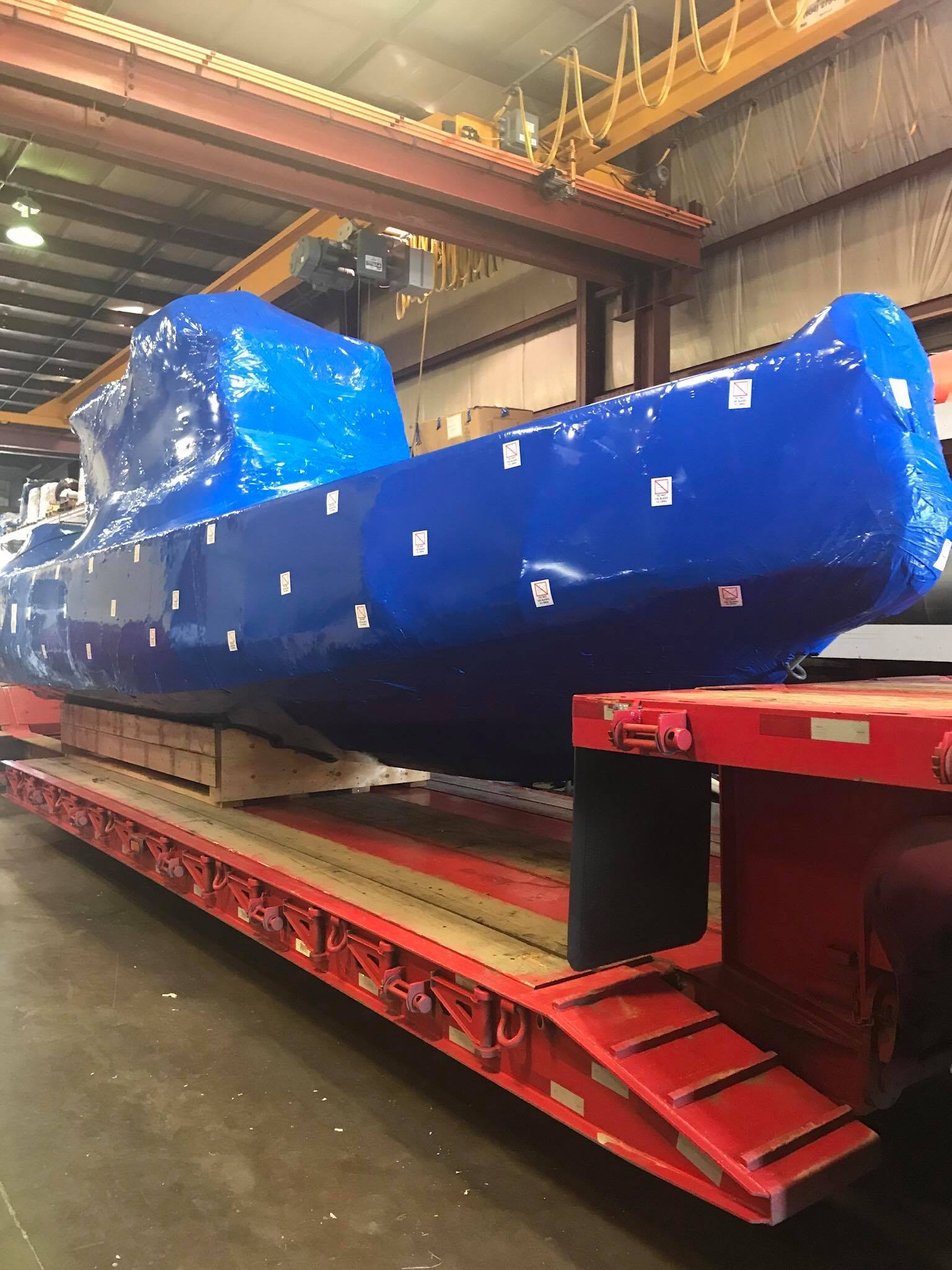 machine-transport-wrapped-industrial-vessel Shrink-wrapped industrial vessel prepared for machine transport