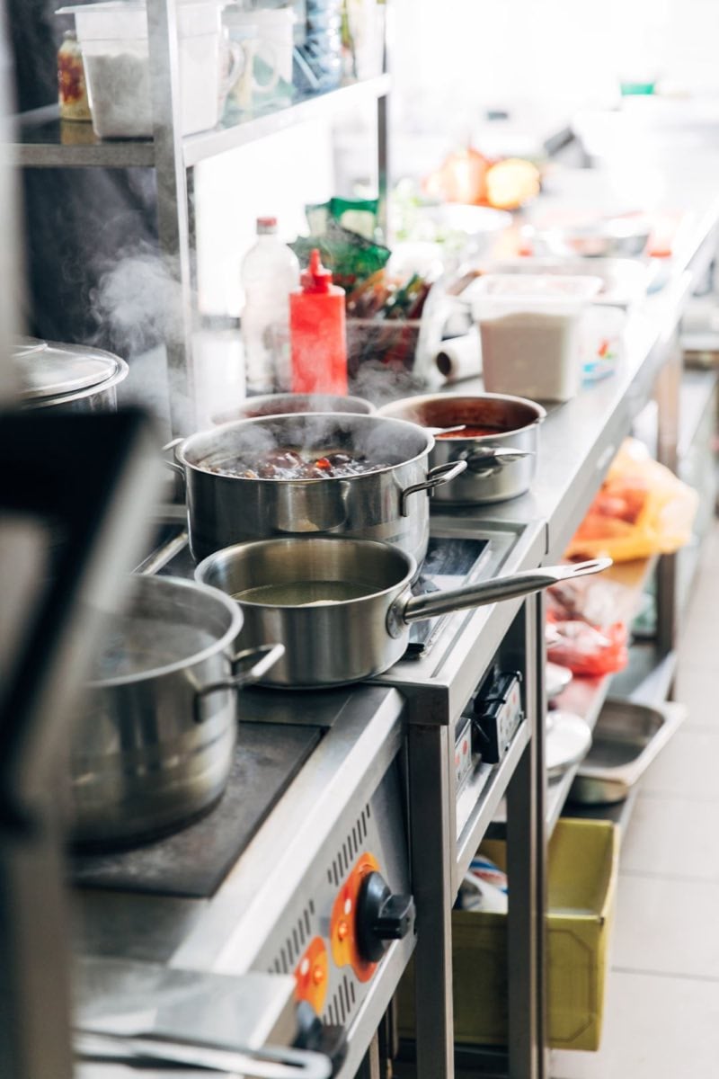 Food service equipment pots cooking in restaurant kitchen