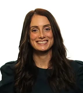 Portrait of a smiling woman with long hair against a white background
