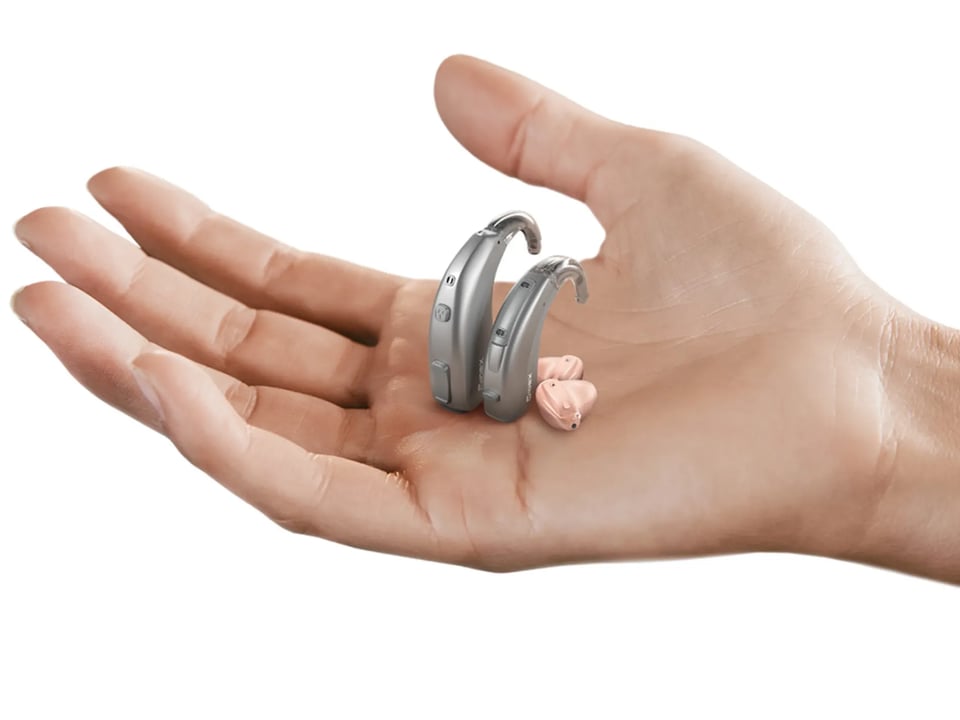 close-up-of-hand-holding-hearing-aids-1000-1000 - The Audiology Place close up of hand holding hearing aids 1000 1000 questions to ask your audiologist when being fitted with hearing aids the audiology place