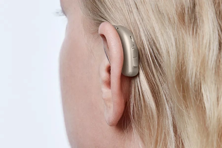 minirite r h1 2023 c090chromabeige angleb45 close up in on ear ms 6689 woman 1200x800px original file oticon real minirite r the audiology place