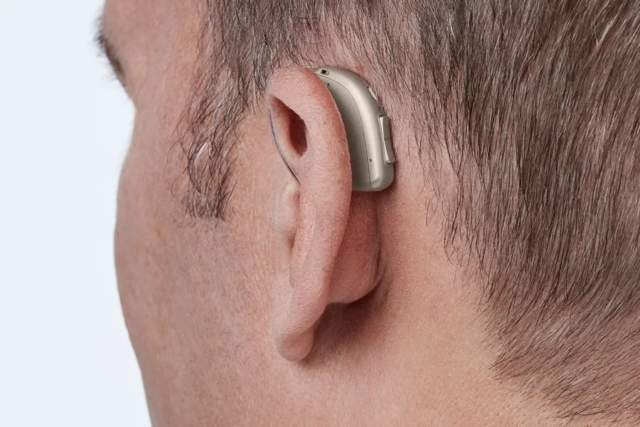 minirite r h1 2023 c090chromabeige angleb45 close up in on ear ms 6902 man 1200x800px original file oticon real minirite r the audiology place