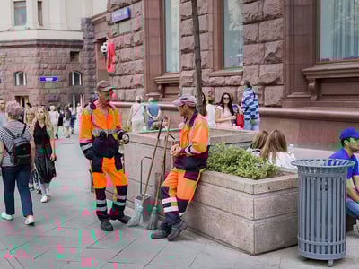 Scenic view of a pristine Irish town square, beautifully maintained with flowers and clean streets, representing Tidy Towns Ireland
