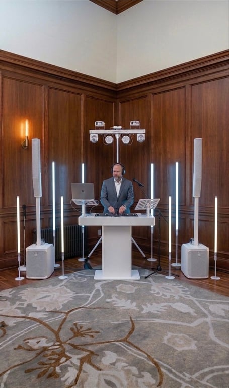 Nathan Watchman all-white DJ and MC setup at Colorado wedding