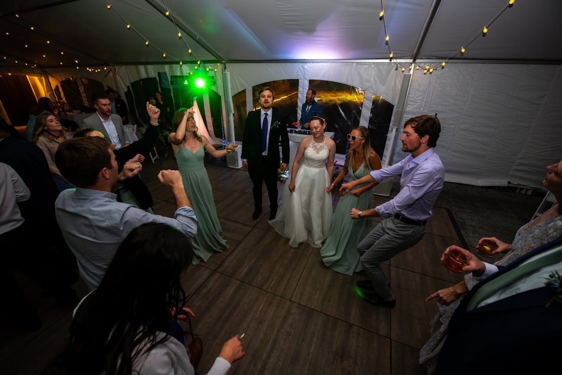 Dance floor with green uplighting at Crested Butte wedding