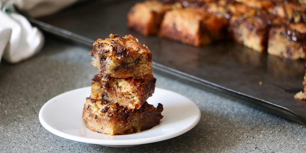247 Easy Marijuana Edibles Recipes to Make at Home 187 A stack of Blondies next to a tray of edible blondies