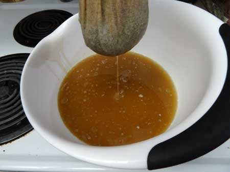 Wring out the butter through the cheesecloth for this step in the cannabutter recipe