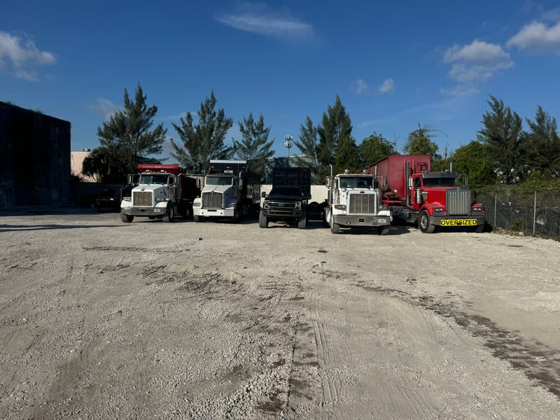 South Florida Demolition Services fleet of semi trucks and dump trucks