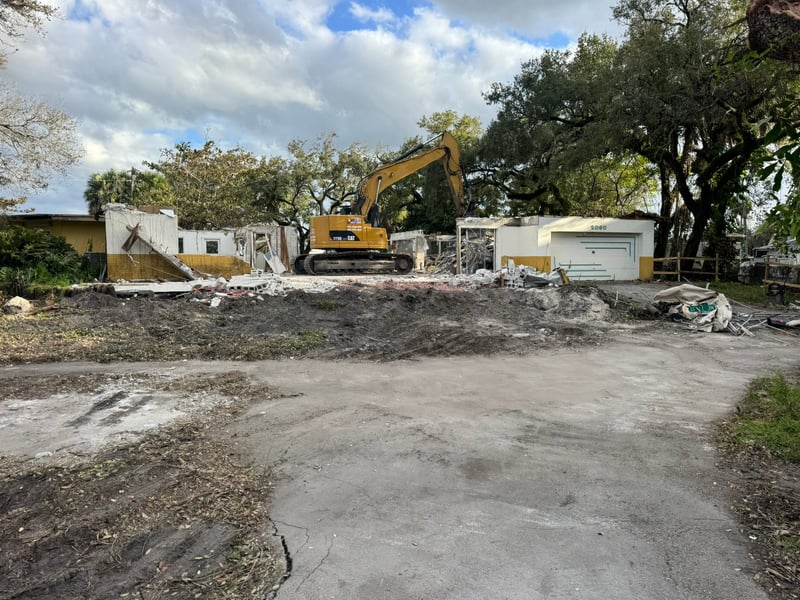 CAT 328 excavator demolishing a residential home in Fort Lauderdale, 2025